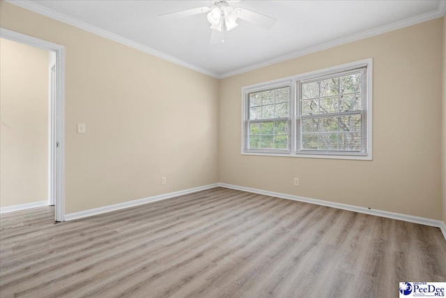 empty room with crown molding, light hardwood / wood-style floors, and ceiling fan