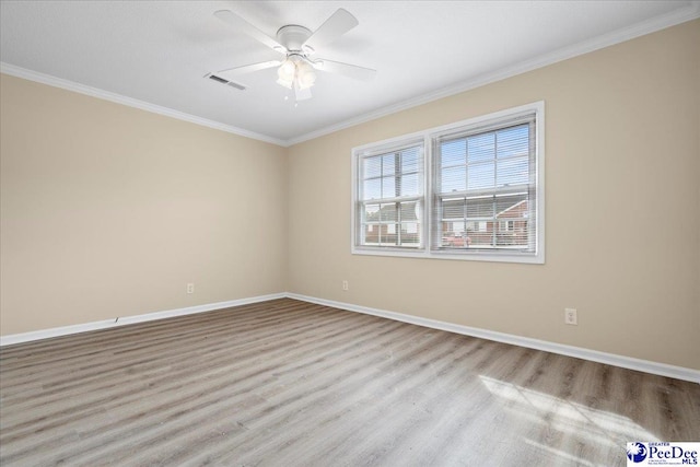 empty room featuring crown molding, ceiling fan, and light wood-type flooring