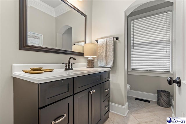 439 Whitman Ave, Florence, SC 29501 - bathroom featuring vanity, ornamental molding, and tile patterned flooring