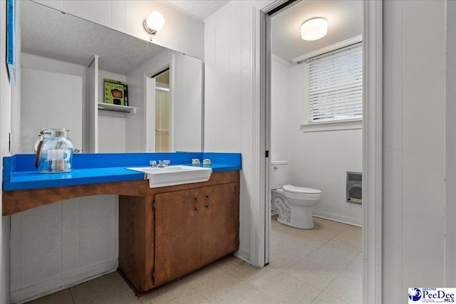 439 Whitman Ave, Florence, SC 29501 - bathroom featuring vanity, tile patterned floors, heating unit, and ornamental molding