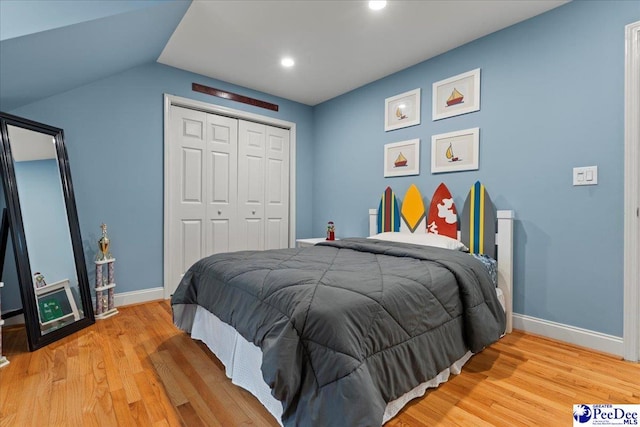 439 Whitman Ave, Florence, SC 29501 - bedroom featuring light wood finished floors, a closet, recessed lighting, and lofted ceiling