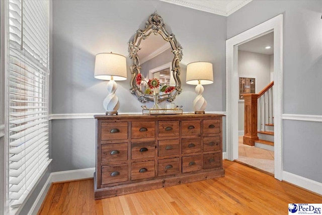 439 Whitman Ave, Florence, SC 29501 - hall with light wood finished floors, crown molding, healthy amount of natural light, and stairs