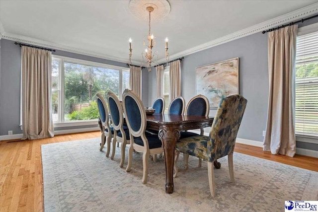 439 Whitman Ave, Florence, SC 29501 - dining space featuring a chandelier, ornamental molding, and wood finished floors