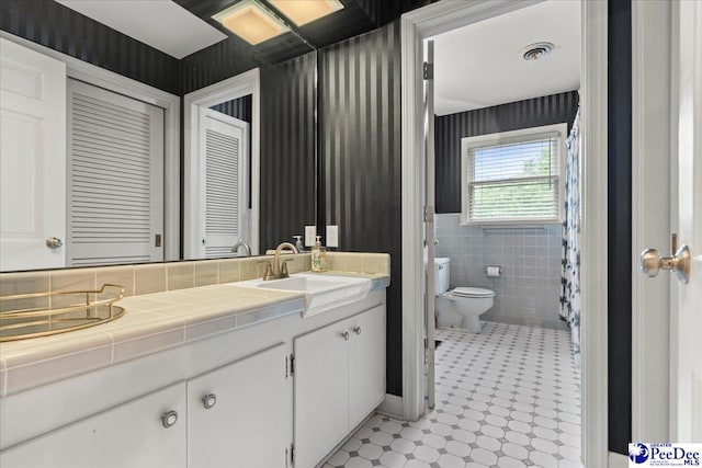439 Whitman Ave, Florence, SC 29501 - bathroom featuring vanity and tile walls