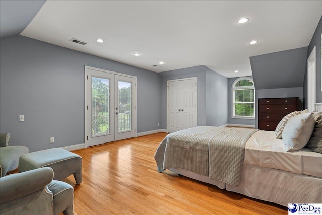 439 Whitman Ave, Florence, SC 29501 - bedroom with access to outside, light wood-type flooring, recessed lighting, vaulted ceiling, and french doors