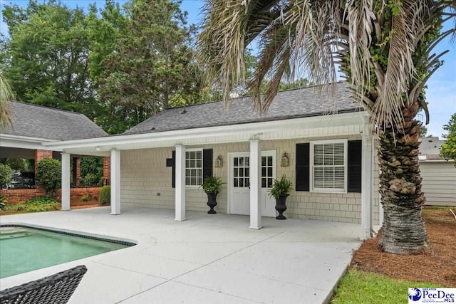 439 Whitman Ave, Florence, SC 29501 - rear view of property with roof with shingles, an outdoor pool, and a patio area