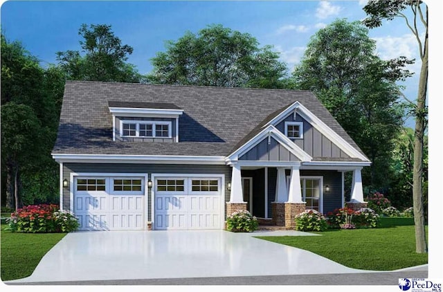 craftsman-style house featuring a garage, driveway, a front lawn, board and batten siding, and brick siding