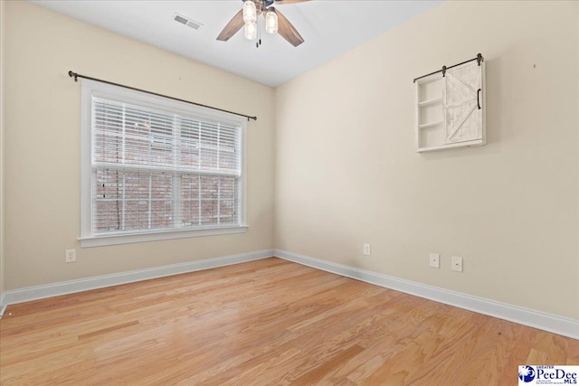 empty room with light hardwood / wood-style flooring and ceiling fan