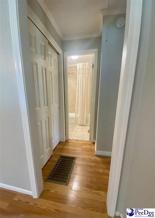 867 Congaree Dr, Florence, SC 29501 - hallway featuring light wood-style floors, ornamental molding, and baseboards