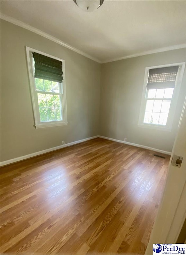 867 Congaree Dr, Florence, SC 29501 - empty room with ornamental molding, wood finished floors, and baseboards