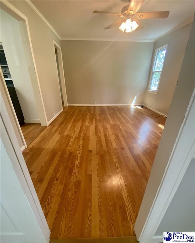 867 Congaree Dr, Florence, SC 29501 - empty room with ornamental molding, a ceiling fan, wood finished floors, and baseboards