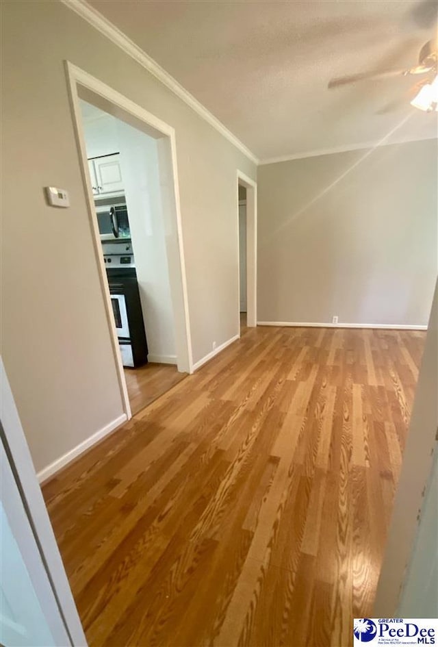 867 Congaree Dr, Florence, SC 29501 - empty room featuring ornamental molding, light wood-style floors, ceiling fan, and baseboards