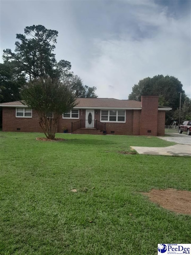 ranch-style home with a front lawn