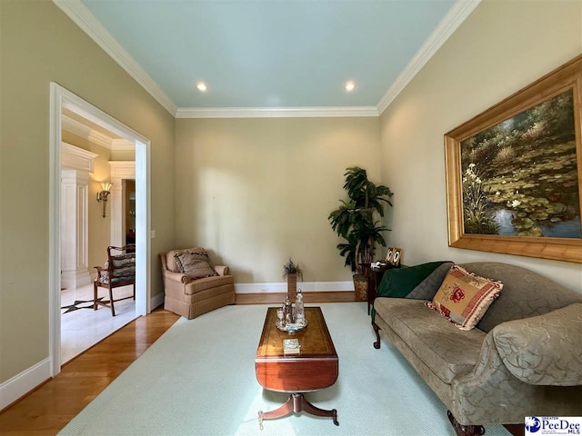 1219 Richard St, Dillon, SC 29536 - living room with crown molding, wood finished floors, baseboards, and recessed lighting