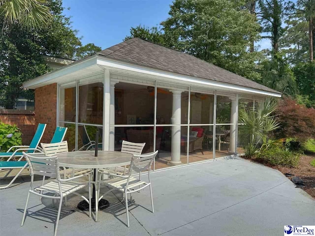 1219 Richard St, Dillon, SC 29536 - view of patio with a sunroom and outdoor dining space