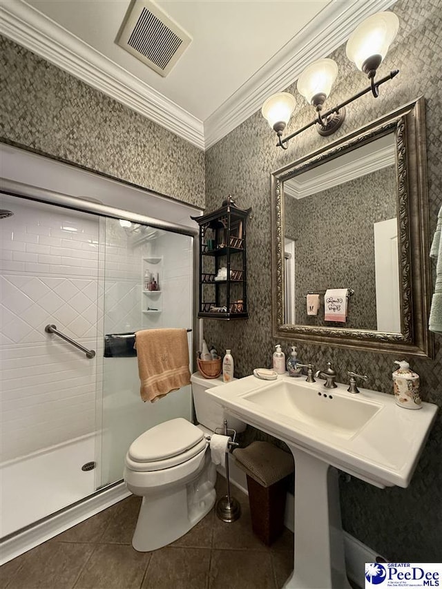 1219 Richard St, Dillon, SC 29536 - bathroom with tile patterned floors, toilet, a shower stall, crown molding, and wallpapered walls