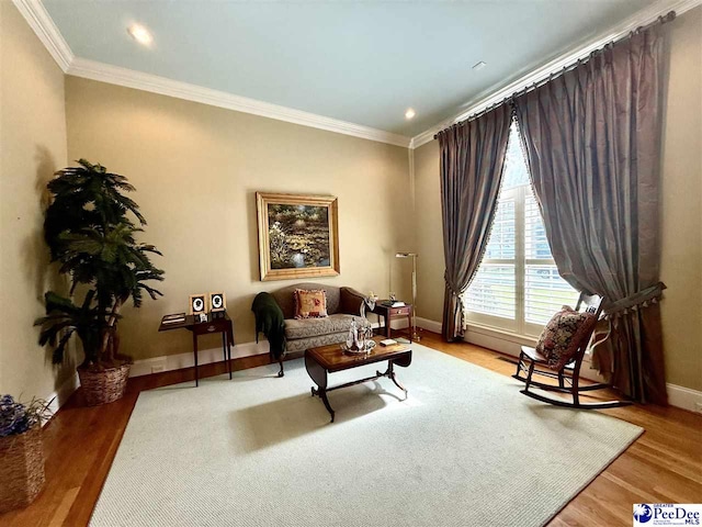 1219 Richard St, Dillon, SC 29536 - living area featuring wood finished floors, crown molding, baseboards, and recessed lighting