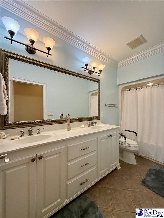 1219 Richard St, Dillon, SC 29536 - full bath with ornamental molding, tile patterned flooring, double vanity, and toilet