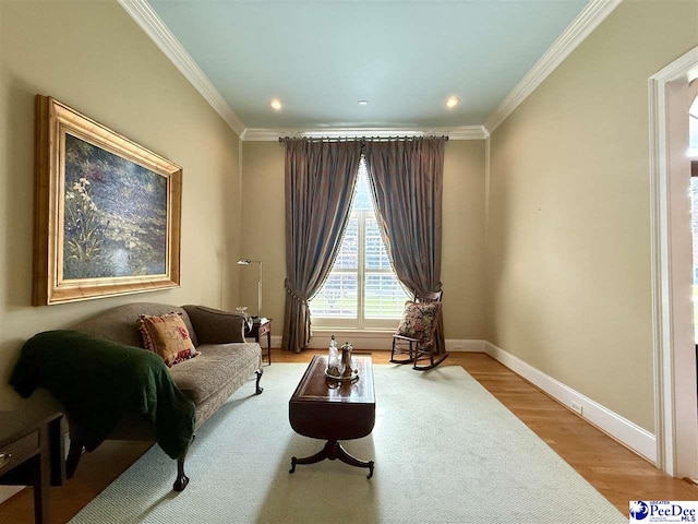 1219 Richard St, Dillon, SC 29536 - living area featuring wood finished floors, crown molding, baseboards, and recessed lighting