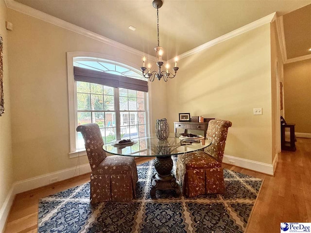 1219 Richard St, Dillon, SC 29536 - dining room with wood finished floors, baseboards, a chandelier, and ornamental molding
