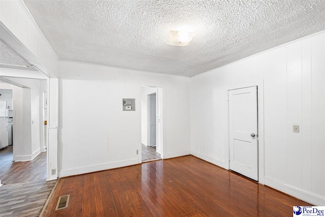 707 Chase St, Florence, SC 29501 - unfurnished room with a textured ceiling and wood finished floors