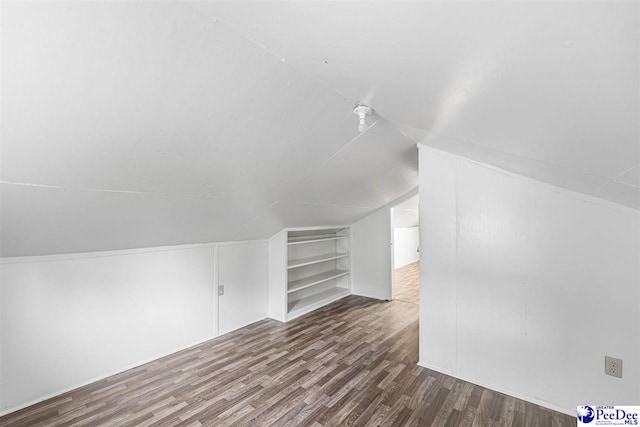 707 Chase St, Florence, SC 29501 - bonus room with built in shelves, wood finished floors, and lofted ceiling