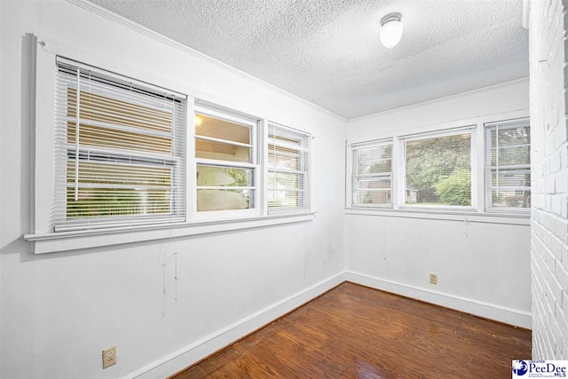 707 Chase St, Florence, SC 29501 - unfurnished room with a textured ceiling, wood finished floors, and ornamental molding