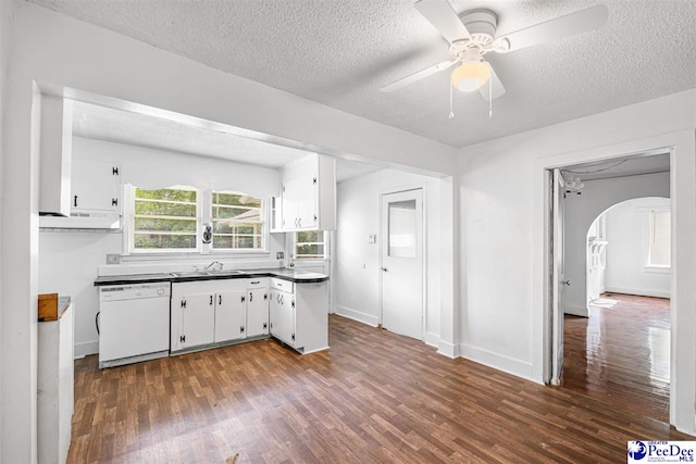 707 Chase St, Florence, SC 29501 - kitchen with white dishwasher, dark countertops, white cabinets, arched walkways, and a textured ceiling