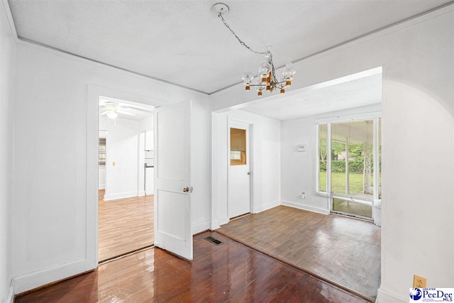 707 Chase St, Florence, SC 29501 - unfurnished dining area with wood finished floors and a chandelier