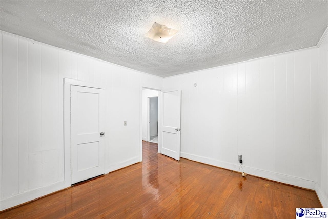 707 Chase St, Florence, SC 29501 - unfurnished room with wood finished floors and a textured ceiling