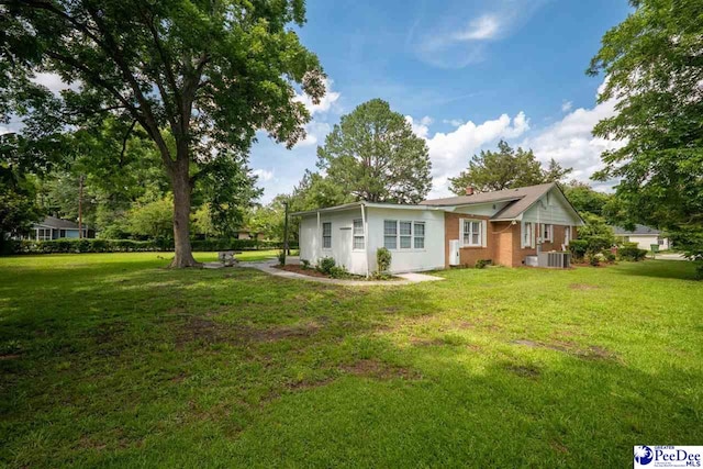 707 Chase St, Florence, SC 29501 - view of side of home featuring a yard