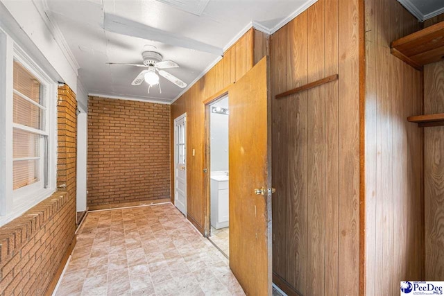 707 Chase St, Florence, SC 29501 - hall with brick wall, crown molding, and wood walls