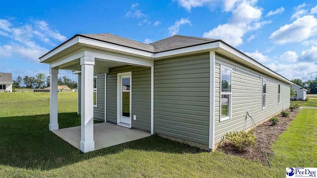 575 Strawberry Field Way, Galivants Ferry, SC 29544 - view of property exterior with a lawn and a patio