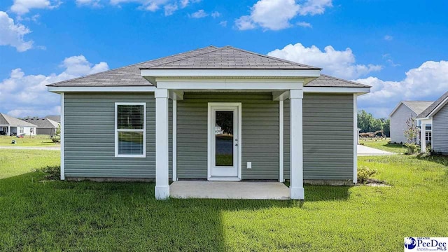 575 Strawberry Field Way, Galivants Ferry, SC 29544 - rear view of house featuring a lawn and a patio area