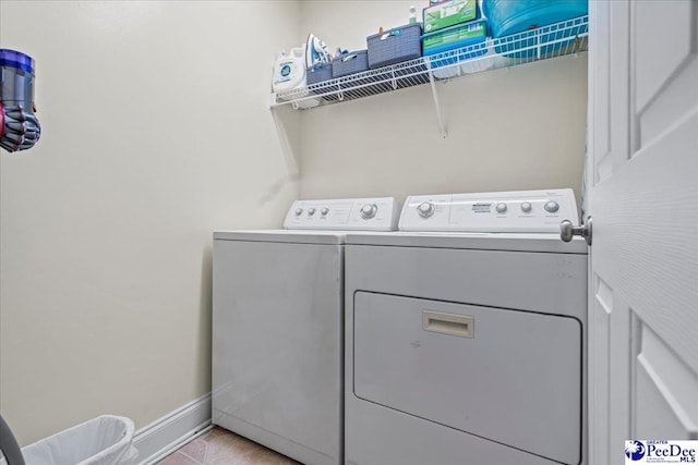 clothes washing area featuring washing machine and dryer