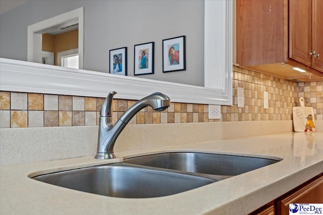 room details with sink and decorative backsplash