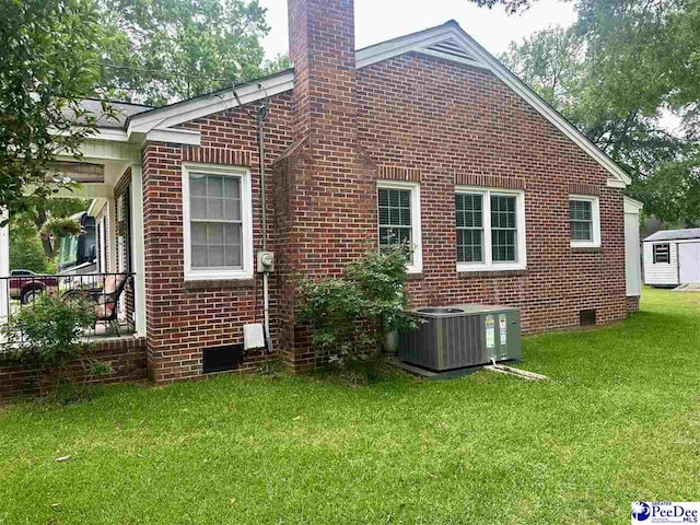 59 Lynn Ave, Cheraw, SC 29520 - view of side of property with central AC unit, crawl space, and brick siding