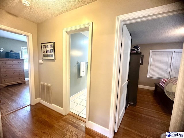 59 Lynn Ave, Cheraw, SC 29520 - hall with a textured ceiling, wood finished floors, and baseboards
