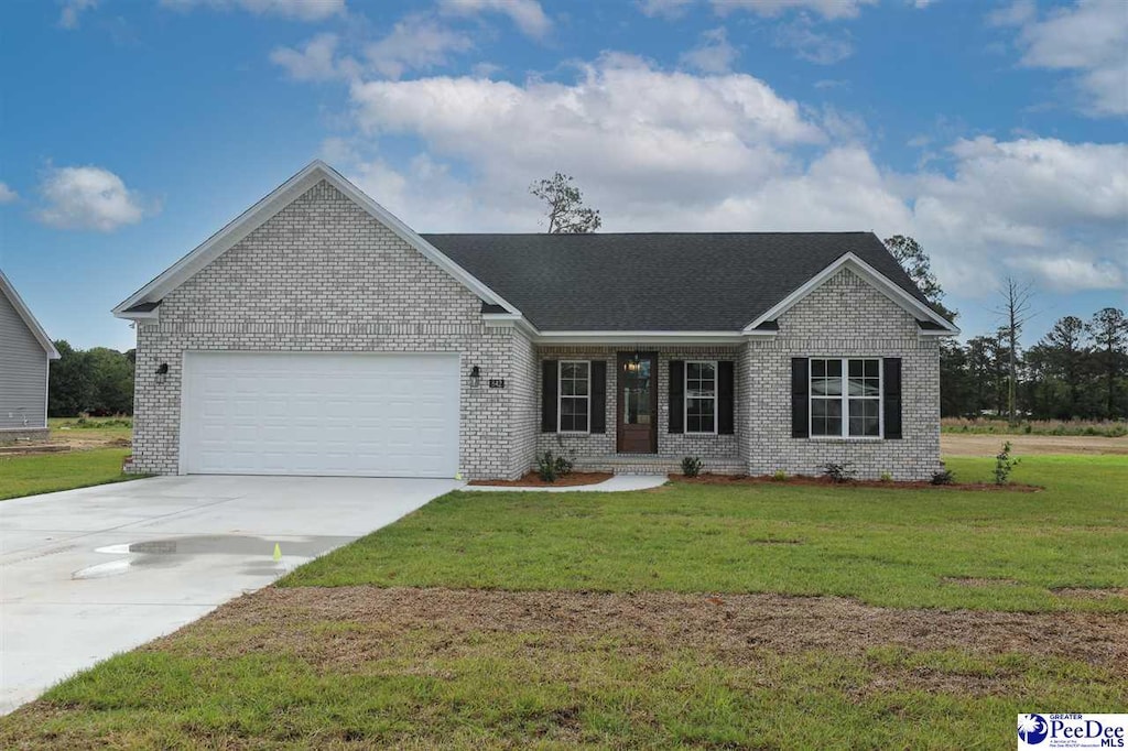 ranch-style house with a garage, a front yard, brick siding, and driveway