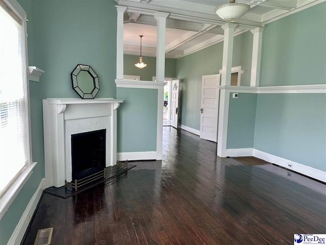 101 W Baptist St, Marion, SC 29571 - unfurnished living room with decorative columns, coffered ceiling, healthy amount of natural light, wood finished floors, and beamed ceiling