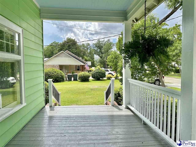 101 W Baptist St, Marion, SC 29571 - wooden deck with a lawn