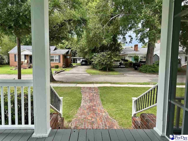 101 W Baptist St, Marion, SC 29571 - view of green lawn featuring covered porch