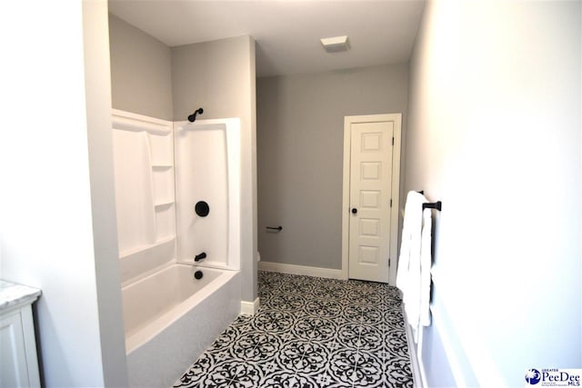 bathroom featuring shower / washtub combination and vanity