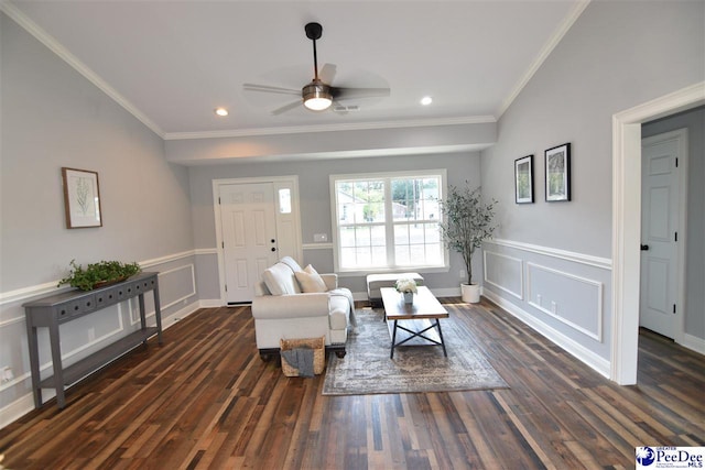 living room with crown molding, dark hardwood / wood-style floors, and ceiling fan