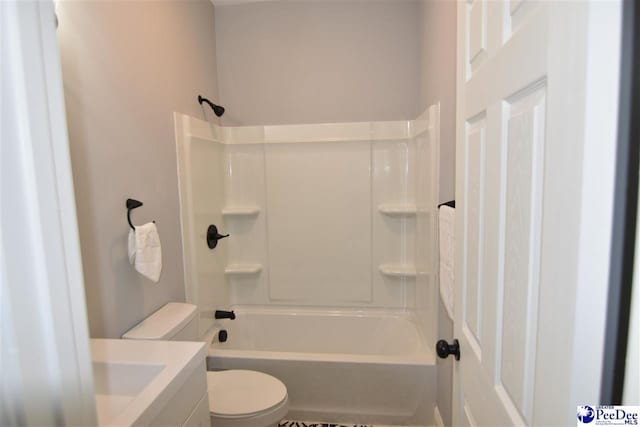 full bathroom featuring shower / bathtub combination, vanity, and toilet