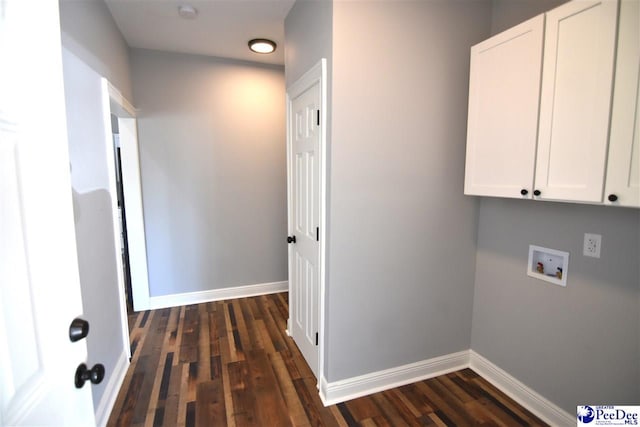 laundry room featuring washer hookup, dark hardwood / wood-style floors, and cabinets