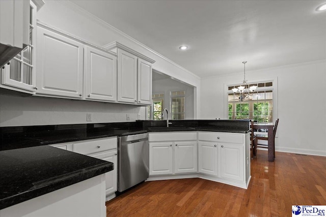 1642 Jefferson Dr, Florence, SC 29501 - kitchen with dishwasher, a sink, a peninsula, a chandelier, and white cabinetry