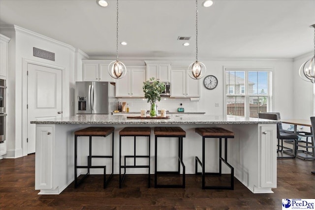 207 Compass Trl, Blythewood, SC 29016 - kitchen with light stone counters, white cabinetry, crown molding, visible vents, and appliances with stainless steel finishes
