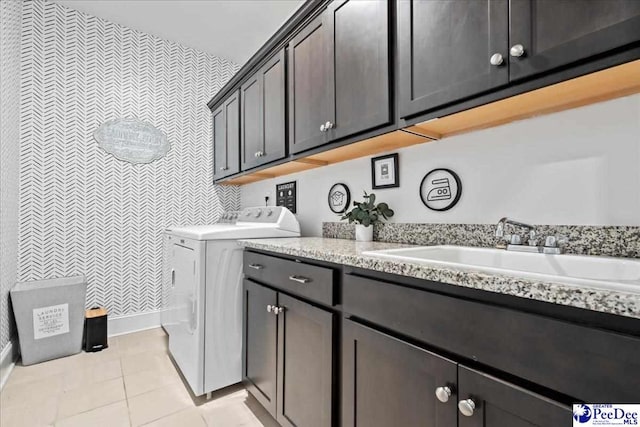 207 Compass Trl, Blythewood, SC 29016 - clothes washing area featuring baseboards, light tile patterned flooring, a sink, and cabinet space