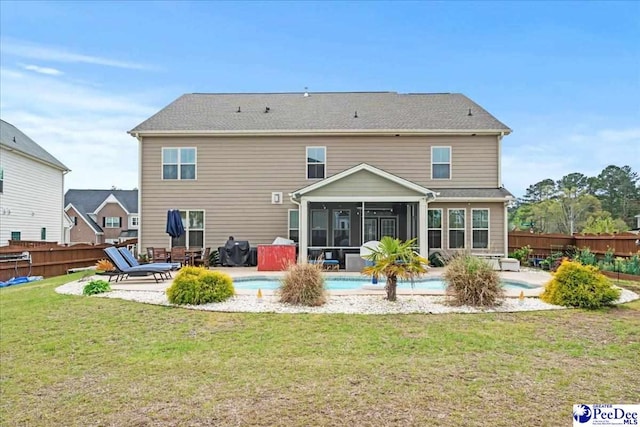 207 Compass Trl, Blythewood, SC 29016 - back of house featuring a sunroom, a patio, fence, and a lawn